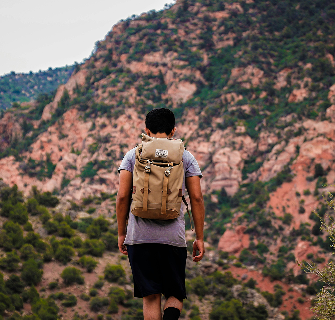Man hiking outside on a sunny day