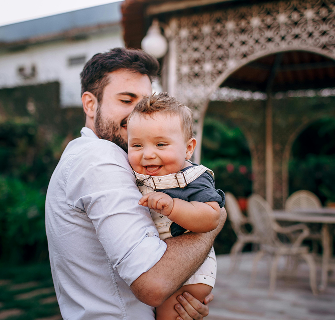 Father holding new baby
