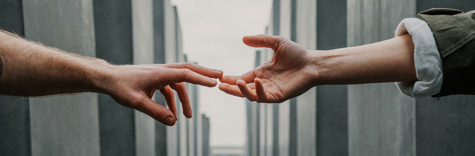 Hands reaching out to each other Hands reaching out to each other